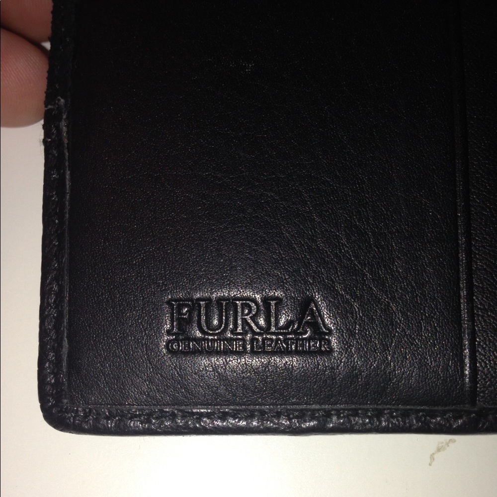 Black leather Furla wallet.